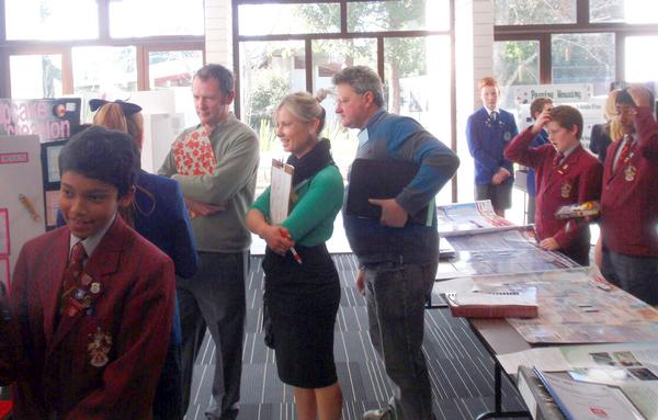  Judges with students from Saint Kentigern school (Remuera) and King's School (Remuera).      